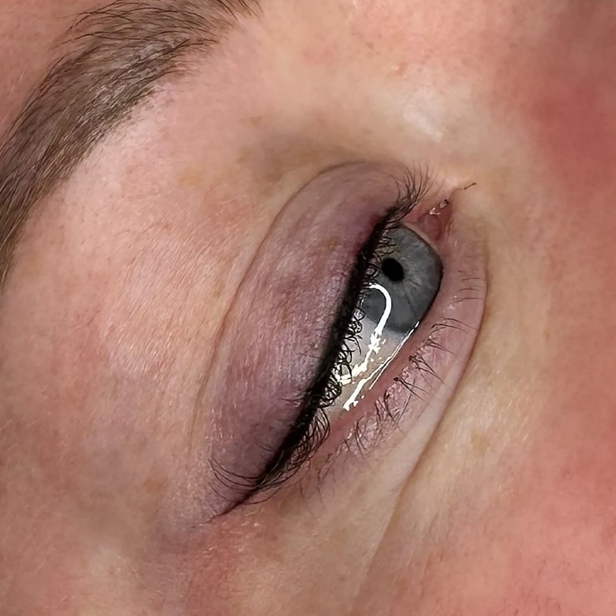 permanent eyeliner procedure being performed